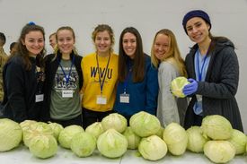 Christina White and classmates with produce