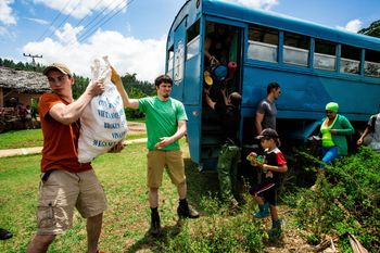Students helping unload van in Cuba
