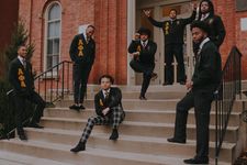 Deionte Harilla-Gray with Alpha Phi Alpha fraternity members in front of Woodburn Hall