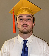 Patrick Doherty wearing a commencement cap