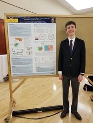 Noah Spencer presents a research poster