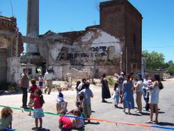 Street protest demanding housing relocation from a squatter settlement built inside a former metals foundry and steel mill in La Teja.