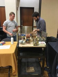 Physics graduate students prepare an experiment